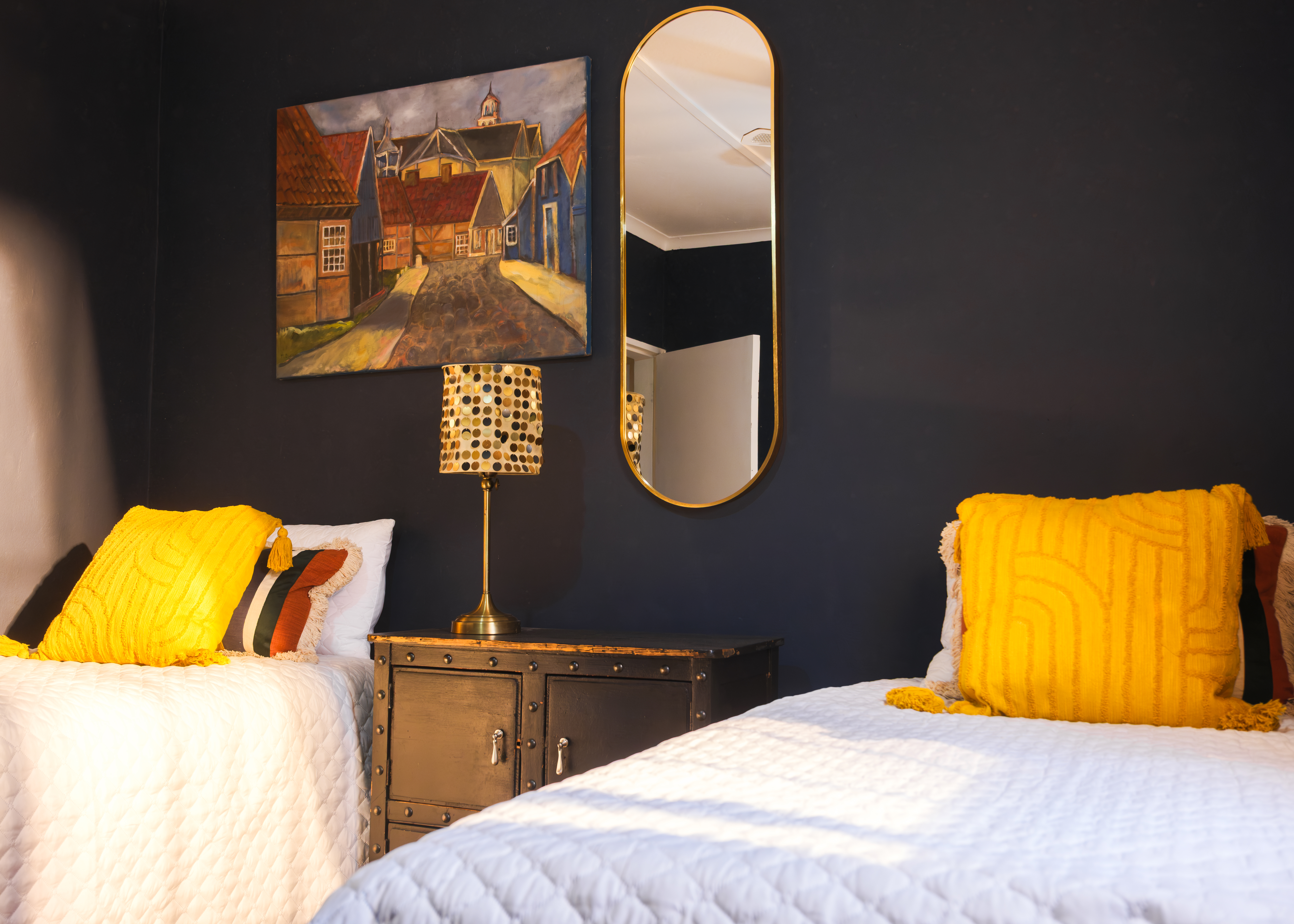Bedroom one with teal curtains